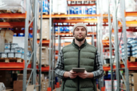 d3fc0319dfdbdbd72f9d2c82c1d7dc56@2x a man in a construction supplies store holding a tablet